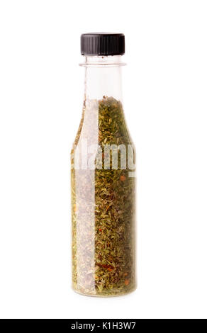 Different spices and herbs in a botle isolated on a white background Stock Photo