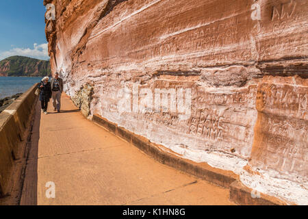 The names of countless visitors from previous years have been scratched into the sandstone cliffs at Sidmouth on the Jurassic Coast, Devon, England, U Stock Photo