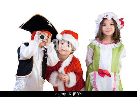 Little boys and girls are in costumes for a school play or ready for halloween enjoying the day against isolated white background. Stock Photo