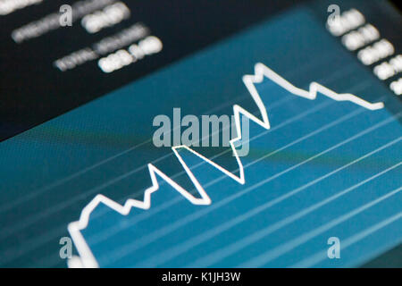 Analyzing stock market from a digital tablet. Stock Photo