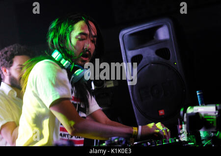 DJ Steve Aoki performing as Danny Masterson watches background Hard Summer Festival Shrine Expo Hall Los Angeles July 19,2008. Stock Photo
