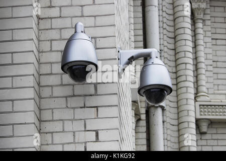 CCTV or surveillance operating on the outer brick wall of the Naval Cathedral of St. Nicholas, Kronstadt Stock Photo