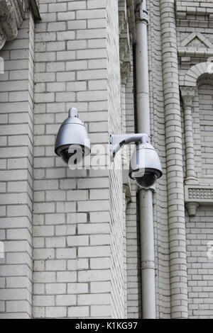 CCTV or surveillance operating on the outer brick wall of the Naval Cathedral of St. Nicholas, Kronstadt Stock Photo