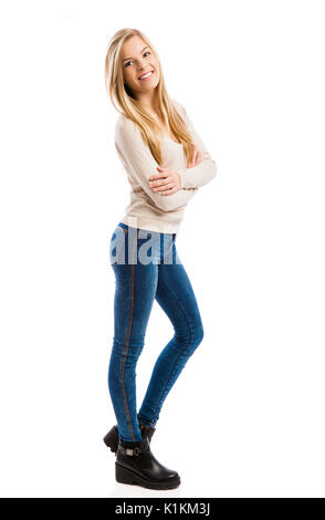 Studio portrait of a teenage girl with arms crossed, isolated in white Stock Photo