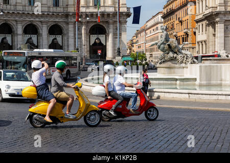 Tourists on Vespa scooters at the Piazza della Repubblica in Rome, Italy Stock Photo