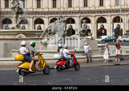 Tourists on Vespa scooters at the Piazza della Repubblica in Rome, Italy Stock Photo