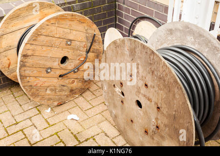 Various drums of steel wire armoured electrical cable on a construction site Stock Photo