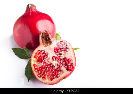 sliced pomegranate on a white background Stock Photo