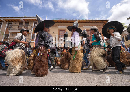 June 24,2017 Cotacachi, Ecuador; men participating at Inti Raymi dances on the street Stock Photo
