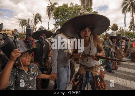 July 24, 2017 Cotacachi, Ecuador: indigenous man holding a gun at Inti Raymi celebration Stock Photo