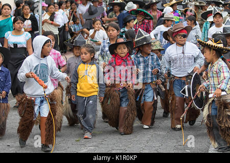 June 24, 2017 Cotacachi, Ecuador: young kichwa indigenous children participating at the summer solstice parade Stock Photo