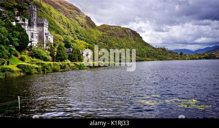 Kylemore Abbey (Irish: Mainistir na Coille Móire) a Benedictine monastery founded in 1920 on the grounds of Kylemore Castle, Connemara, County Galway. Stock Photo