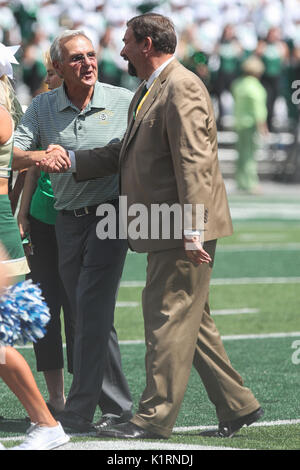 August 26, 2017: Colorado State President Tony Frank (right) shakes the hand of former football coach Sonny Lubick, whom the new field is named after. The ceremny occurred during a timeout of the game against Oregon State. Stock Photo