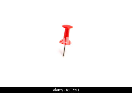 Red color push pin and on isolated white background Stock Photo