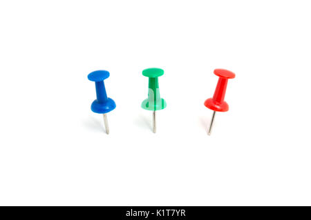 Three color push pin and on isolated white background Stock Photo