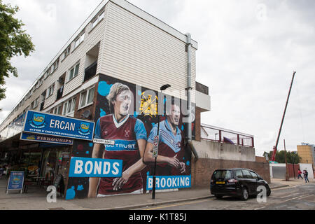 London, UK. 24th August 2017. GnasherMurals's mural of ex-players Billy Bonds and Sir Trevor Brooking alongside the former site of the Boleyn Ground. Stock Photo