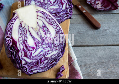 Organic Red (Blue, Purple) Cabbage on Wooden Cutting Board, copy space - fresh healthy food ingredient, ready for cooking Stock Photo