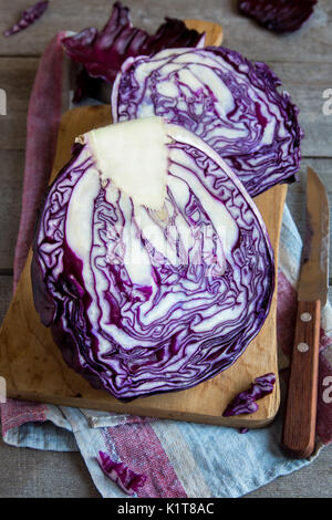 Organic Red (Blue, Purple) Cabbage on Wooden Cutting Board, copy space - fresh healthy food ingredient, ready for cooking Stock Photo
