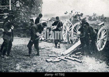 This photo taken in early World War I has the caption: French artillery in action, the gunners trying to protect their ear-drums from the shock. During Von Kluck's great drive on Paris, the french artillery did wonderful servie in holding their ground to the last possibe moment then retreating and taking up another defensive position. Stock Photo