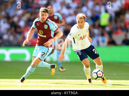 Burnley's Robbie Brady (left) and Tottenham Hotspur's Christian Eriksen battle for the ball during the Premier League match at Wembley, London. Stock Photo
