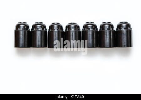 Set of plastic and ceramic electric cartriges for bulb isolated on white. Top view Stock Photo