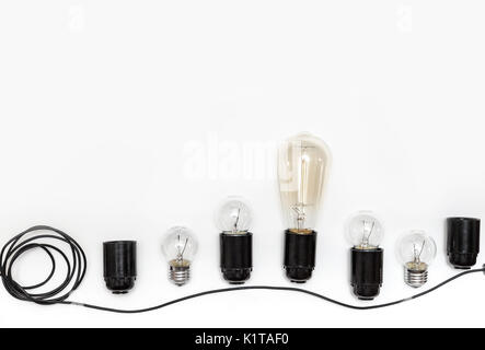 Retro light bulb, cartridges and wires for retro garlands on a white background isolated. View from above. Stock Photo