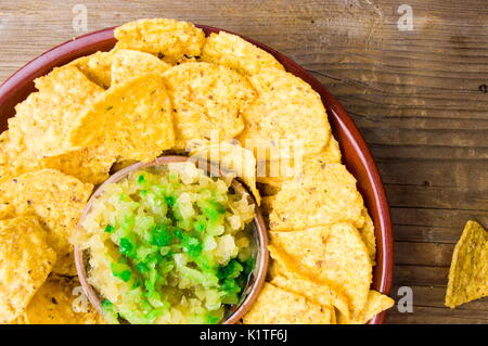 Tortilla chips with homemade sauce on the table Stock Photo