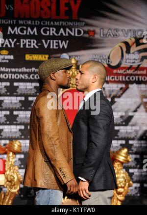 US boxer Floyd Mayweather (L) WBA Super Welterweight World Champion Miguel Cotto Puerto Rico faceoff during press conference Grauman's Chinese Theatre Hollywood March 1,2012. Mayweather Cotto will meet WBA Super Welterweight World Championship fight May 5 MGM Grand Las Vegas. Stock Photo