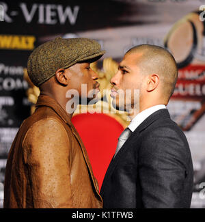 US boxer Floyd Mayweather (L) WBA Super Welterweight World Champion Miguel Cotto Puerto Rico faceoff during press conference Grauman's Chinese Theatre Hollywood March 1,2012. Mayweather Cotto will meet WBA Super Welterweight World Championship fight May 5 MGM Grand Las Vegas. Stock Photo