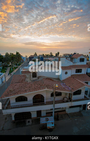 The sun setting over the South American ocean town of Huanchaco, Peru. Stock Photo
