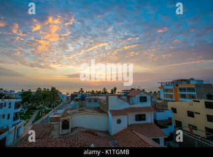 The sun setting over the South American ocean town of Huanchaco, Peru. Stock Photo