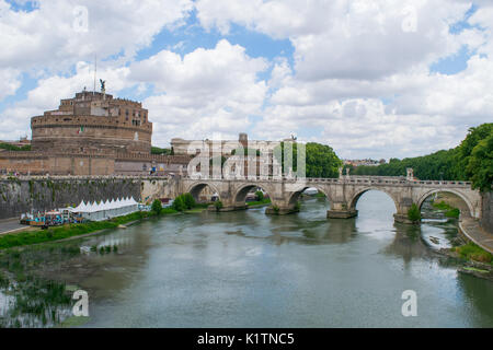 The historic building of Castel Sant'Angelo, former prison and Hadrian's Tomb, next to the Tiber River and bridge, on a summer day, Rome, Italy Stock Photo