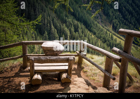 View on the summer landscape mountains from wooden bench. Rabby Valley, Trentino Alto Adige, northern Italy. Stock Photo