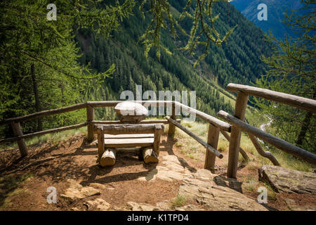 View on the summer landscape mountains from wooden bench. Rabby Valley, Trentino Alto Adige, northern Italy. Stock Photo