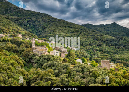Storm clouds over village of Pino, Cap Corse, Corsica, France Stock Photo