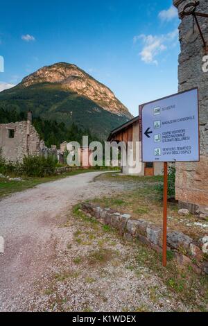 And path and an information table in the mining center of Valle Imperina, National Park Belluno Dolomites, Rivamonte agordino, dolomites Stock Photo