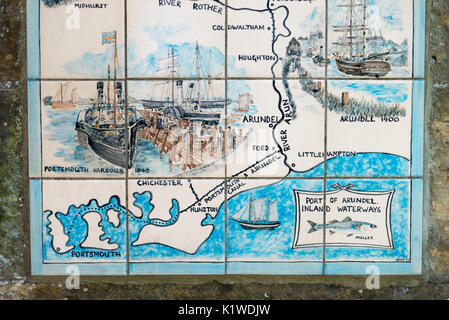 A map painted on tiles showing the town of Arundel and the course of the River Arun fixed to a wall in Arundel, West Sussex, England. Stock Photo