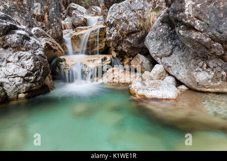 Small waterfalls of turquoise water in val Salet, Monti del Sole, National park Belluno Dolomites, Italy Stock Photo