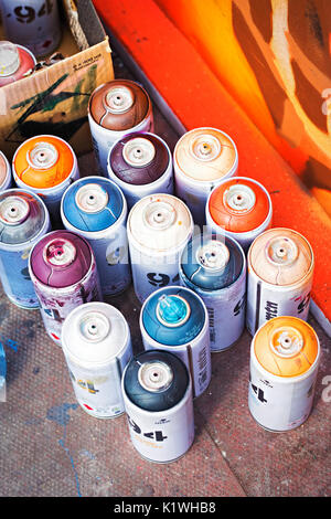 Used cans of spray paint to make urban art on wall Stock Photo - Alamy