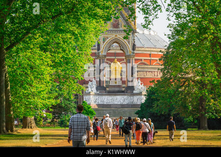 Kensington Gardens London, tourists head towards the Albert Memorial in Kensington Gardens on a summer afternoon, London, UK. Stock Photo