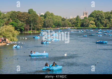 Hyde Park London, view of tourists enjoying a summer afternoon on the Serpentine Lake in Hyde Park, London, UK. Stock Photo