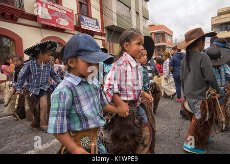 June 24, 2017 Cotacachi, Ecuador: indigenous kichwa children at the Inti Raymi parade at summer solstice Stock Photo