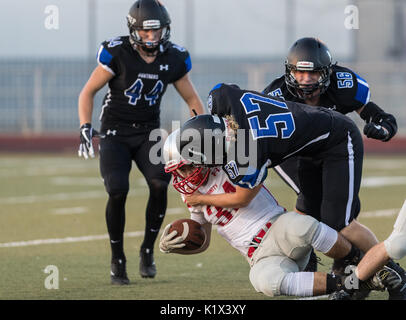 Football action with Trinity vs. University Prep High School in Redding, California. Stock Photo