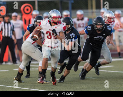 Football action with Trinity vs. University Prep High School in Redding, California. Stock Photo