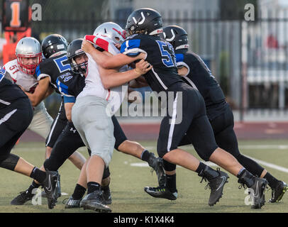 Football action with Trinity vs. University Prep High School in Redding, California. Stock Photo