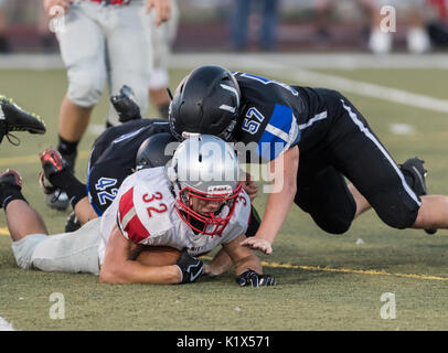 Football action with Trinity vs. University Prep High School in Redding, California. Stock Photo