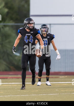 Football action with Trinity vs. University Prep High School in Redding, California. Stock Photo