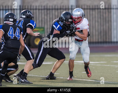 Football action with Trinity vs. University Prep High School in Redding, California. Stock Photo