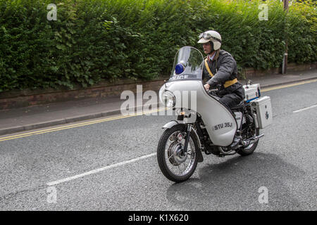 1969 60s Triumph 650cc TR6P Police Motorcycle; White triumph saint Police Motorcycle; Vintage uniformed motorcyclists at the 2017 Ormskirk MotorFest on Sunday 27 August. 300 vintage, classic motorcycles from all eras of motoring lined up on town centre streets for people to admire. Thousands of people attended Ormskirk for this fantastic free family event to admire the fabulous range of vehicles. Stock Photo