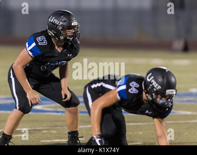 Football action with Trinity vs. University Prep High School in Redding, California. Stock Photo